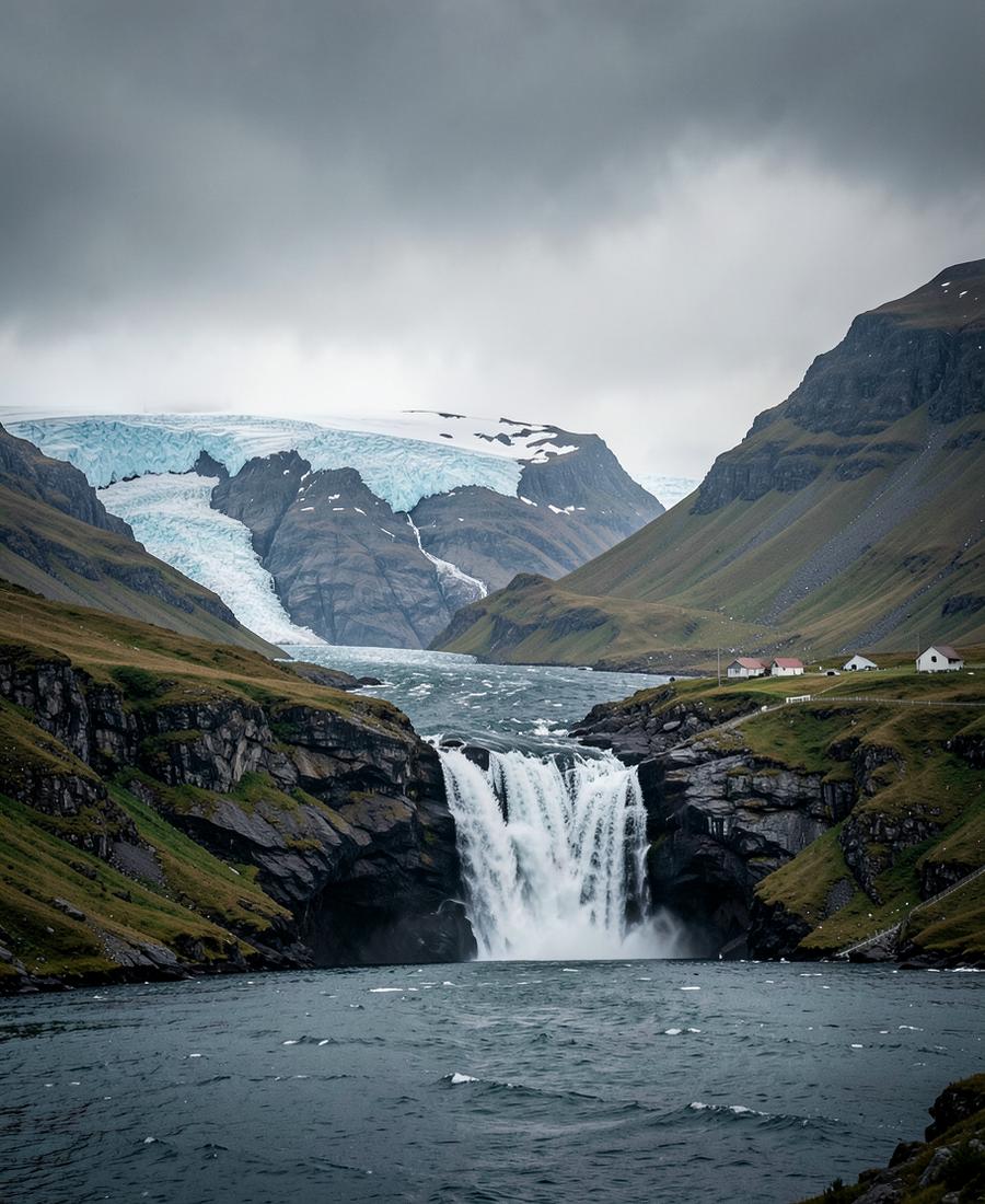 Waterfall and glacier above a remote North Atlantic fjord settlement